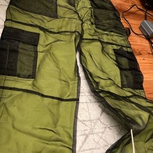 green and black pants